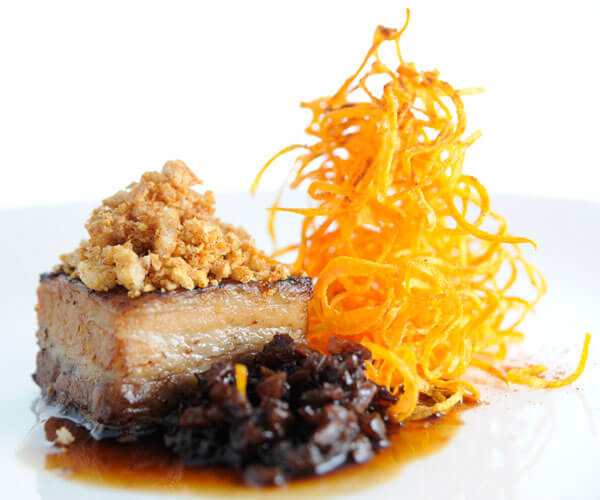 Jamaican slow-braised pork belly with sweet potato fritz