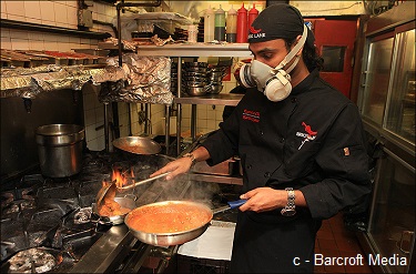 Chefs wear gas masks to prepare this spicy Indian dish