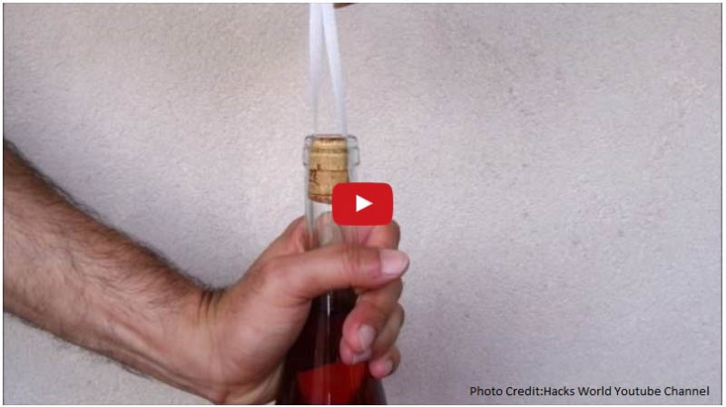 How to open a cork stuck in a wine bottle with a ribbon.